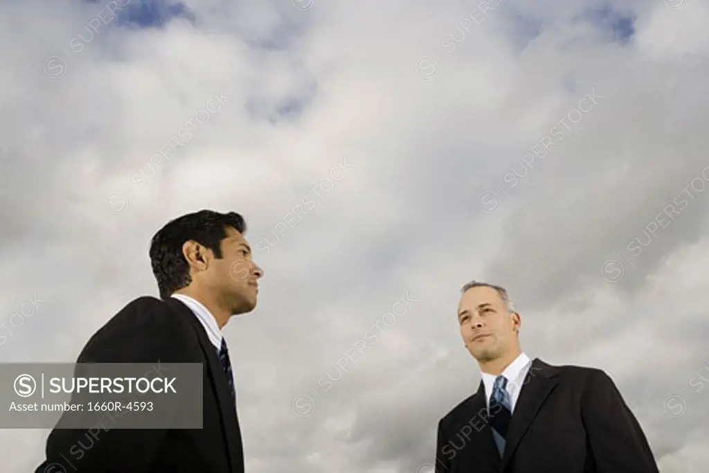 Low angle view of two businessmen standing