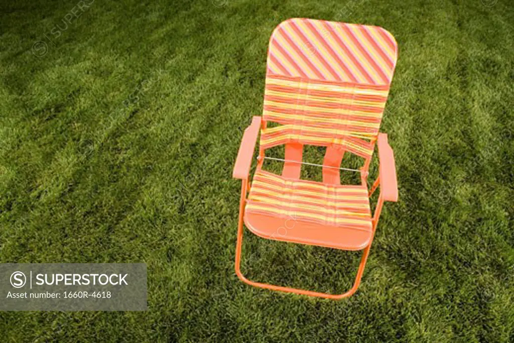 High angle view of a chair on a lawn