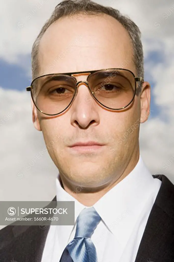 Close-up of a businessman looking at the camera