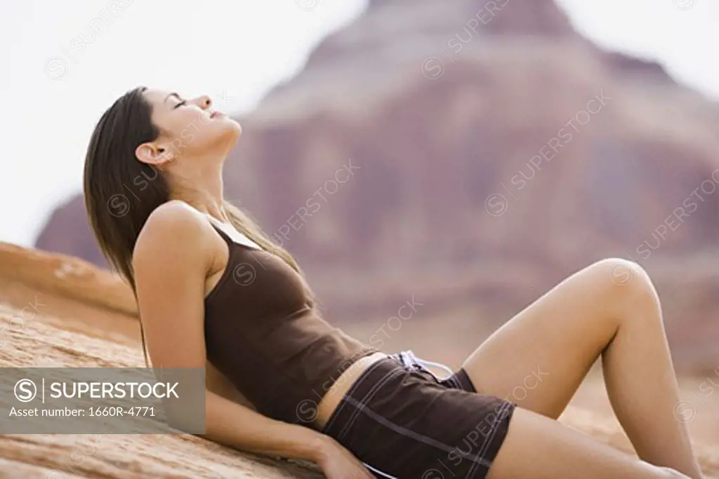 Profile of a young woman lying on her back