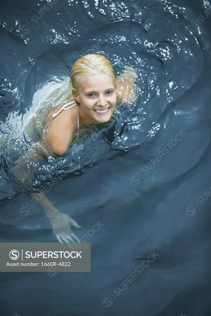 High angle view of a young woman swimming