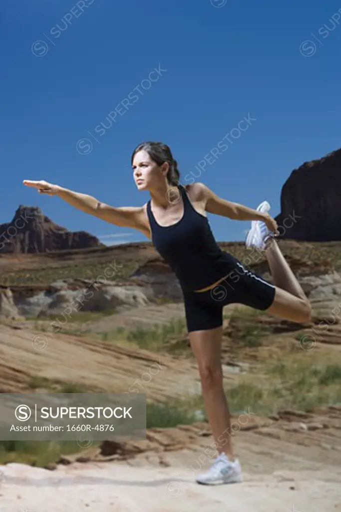Low angle view of a young woman exercising