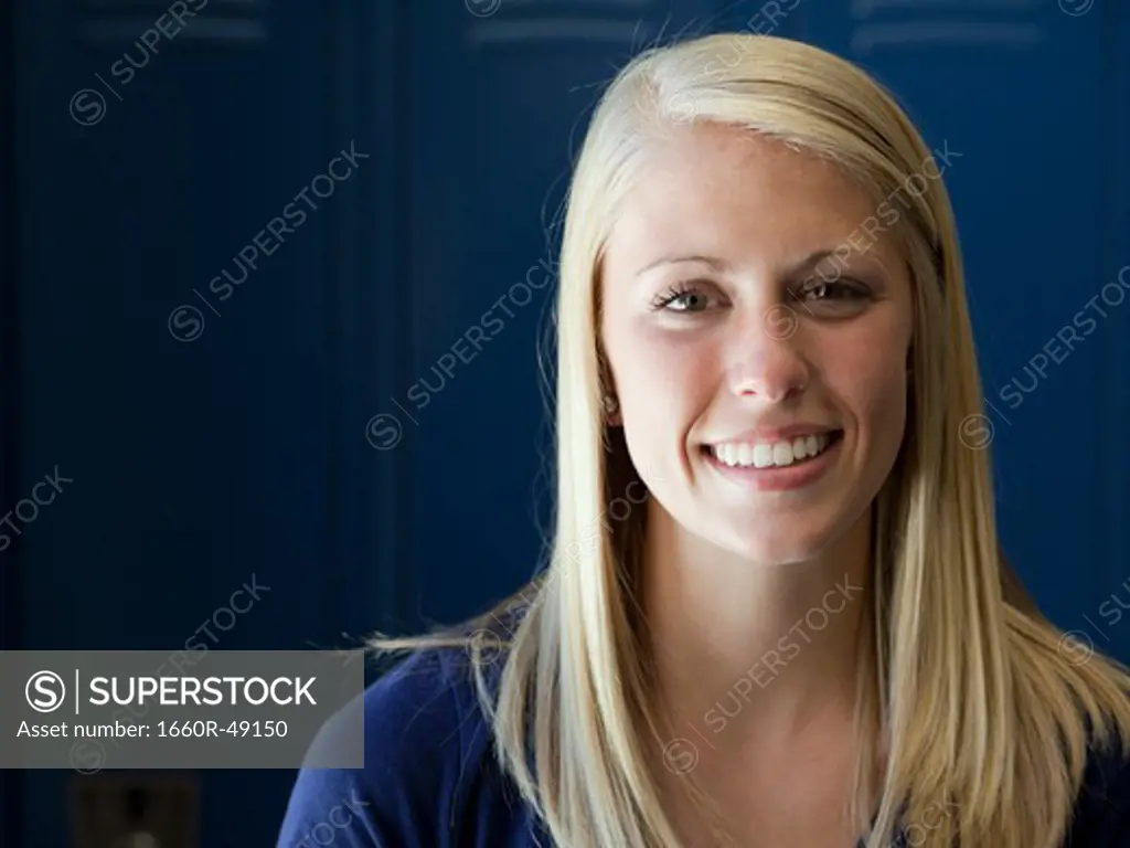 USA, Utah, Spanish Fork, Portrait of school girl (16-17) smiling by lockers