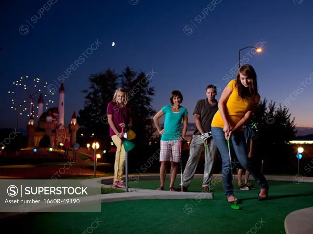 USA, Utah, Orem, Parents and kids (10-17) playing golf