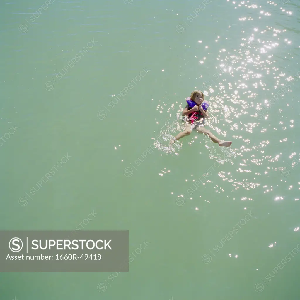 USA, Utah, Lake Powell, Girl (6-7) floating on water