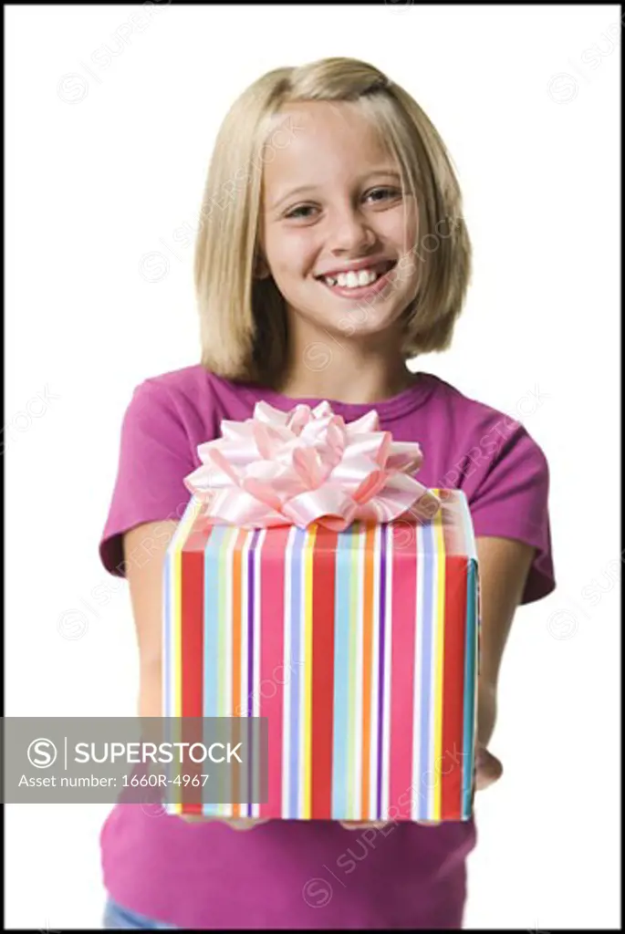 Young girl holding a gift