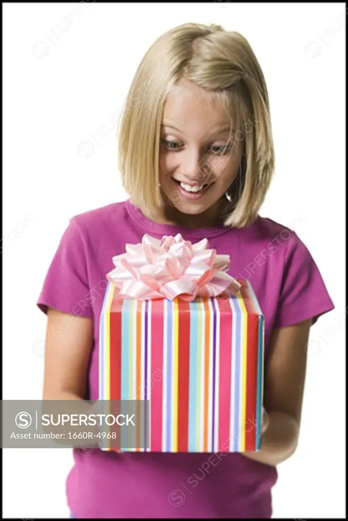 Young girl holding a gift