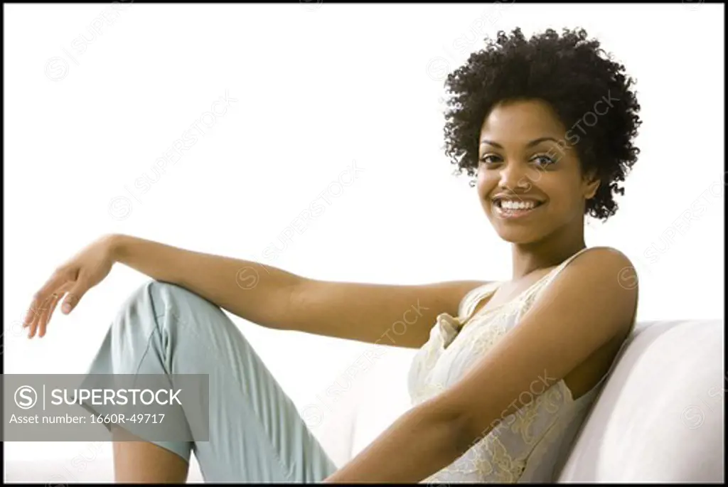 Woman posing and relaxing on sofa