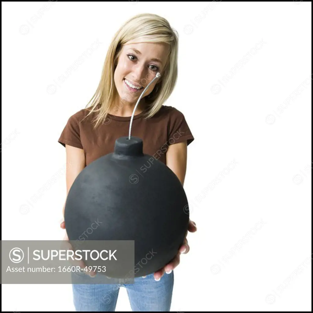 Woman posing and holding bomb