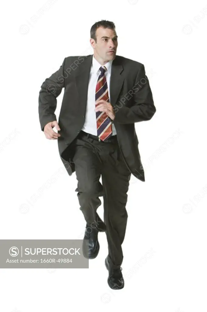 Man running in three piece suit