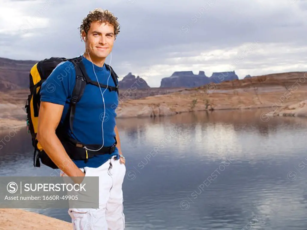 Man with backpack and scenic background