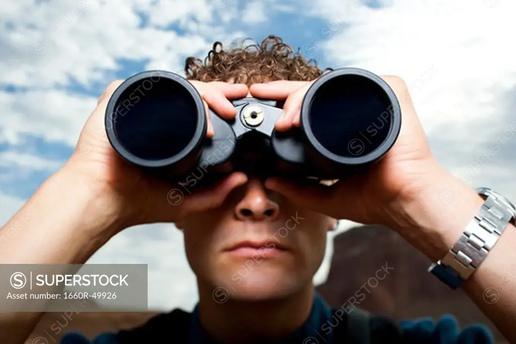 Close-up of man with binoculars