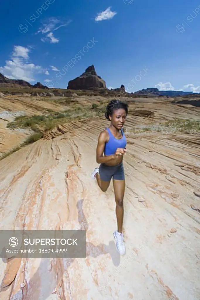 A woman running in the desert
