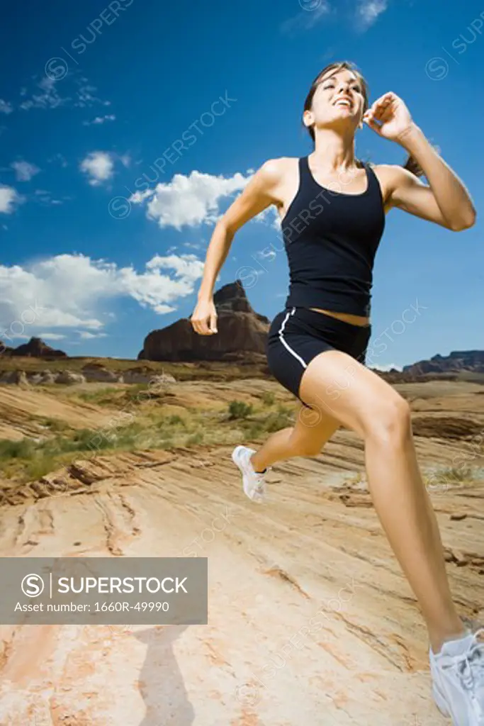 Woman running in desert
