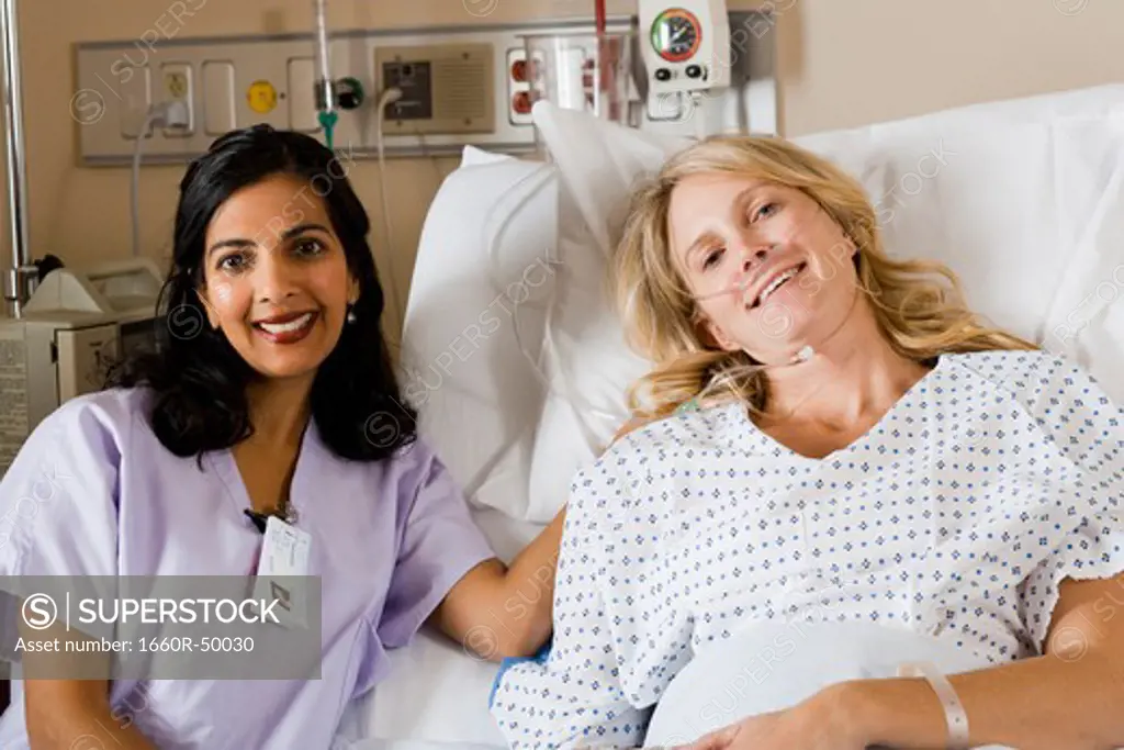 Woman in hospital bed smiling