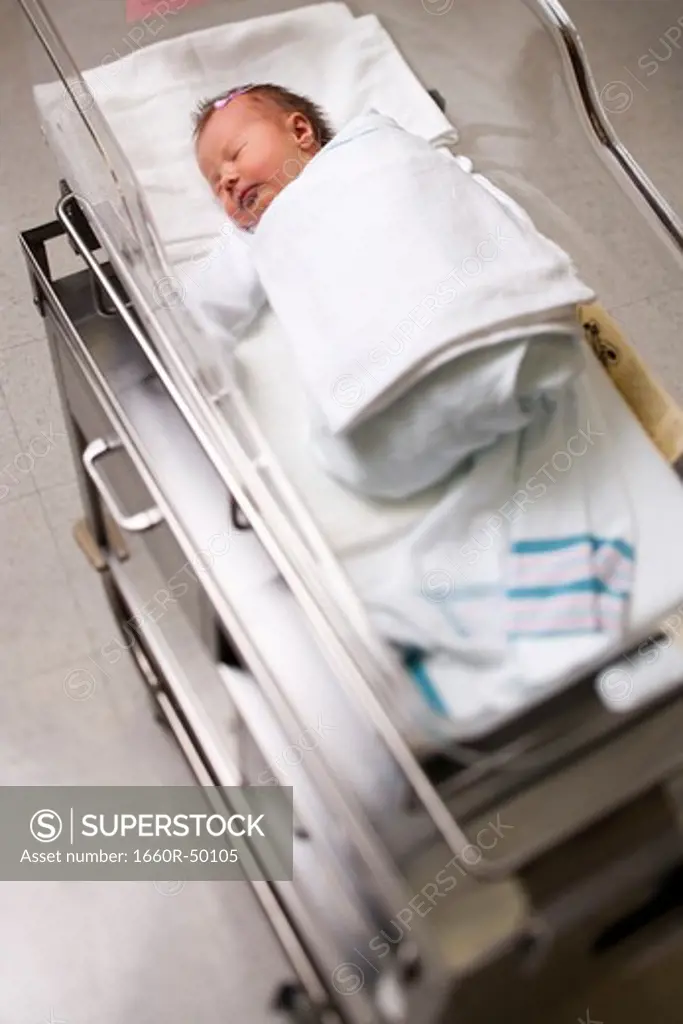 Newborn girl in incubator