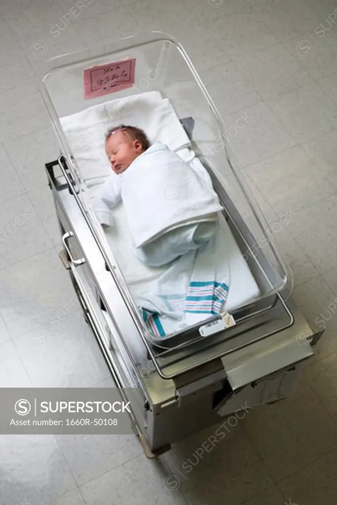Newborn girl in nursery from above