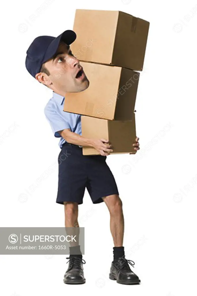 Delivery man holding cardboard boxes