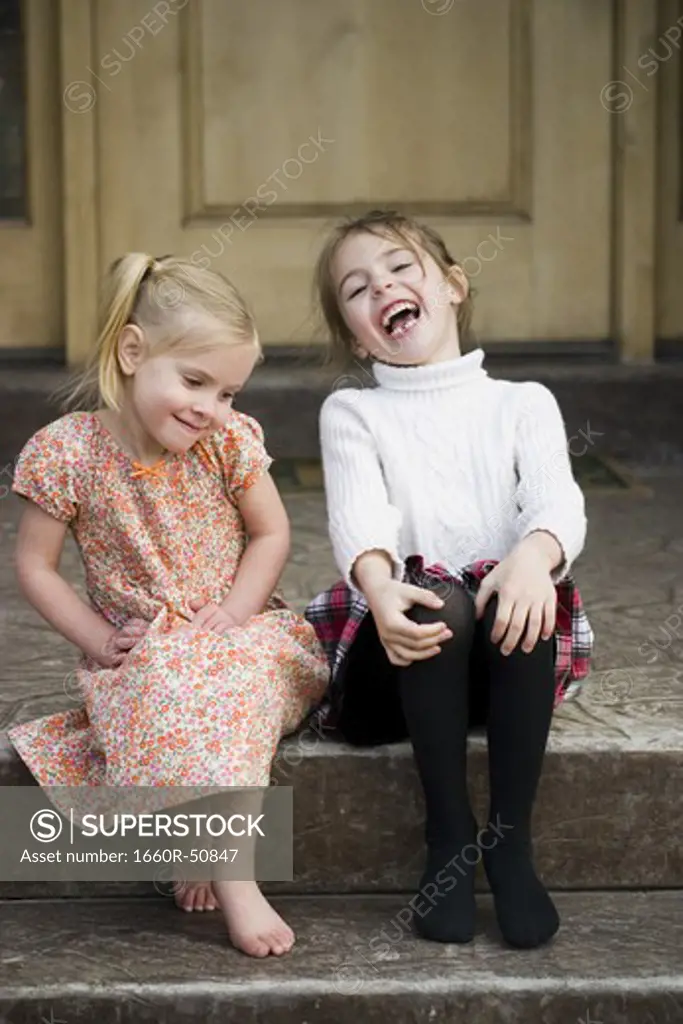 Two little girls laughing