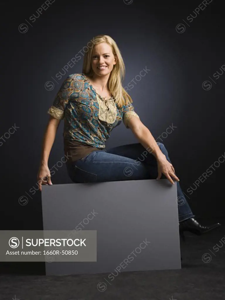 Smiling woman posing with back to the camera
