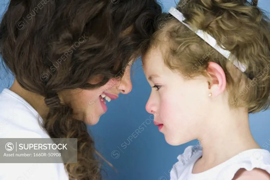 Two girls rubbing noses