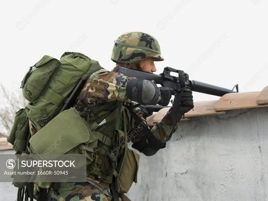 Soldier aiming weapon