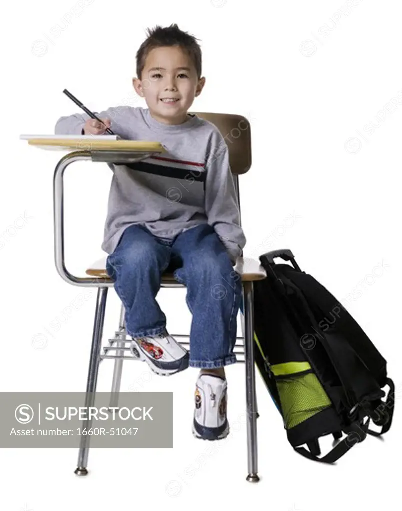 Schoolboy at desk