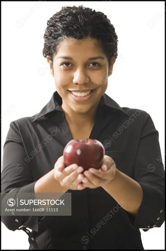 Female teacher standing in front of a blackboard
