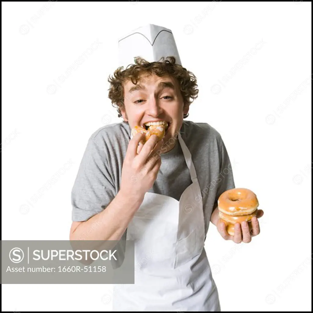 Cook eating donuts