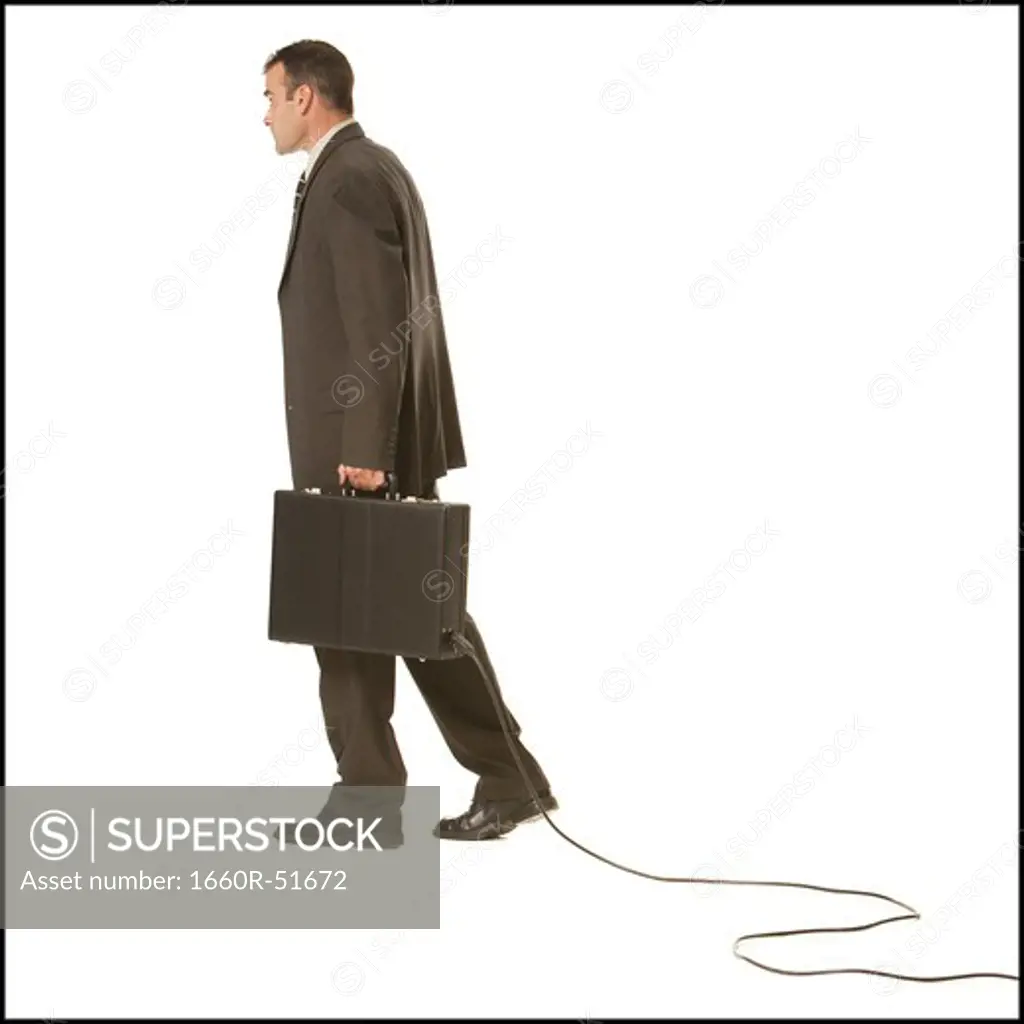 Businessman with briefcase and cable