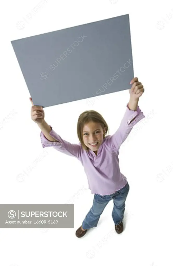 High angle view of a girl holding a blank sign