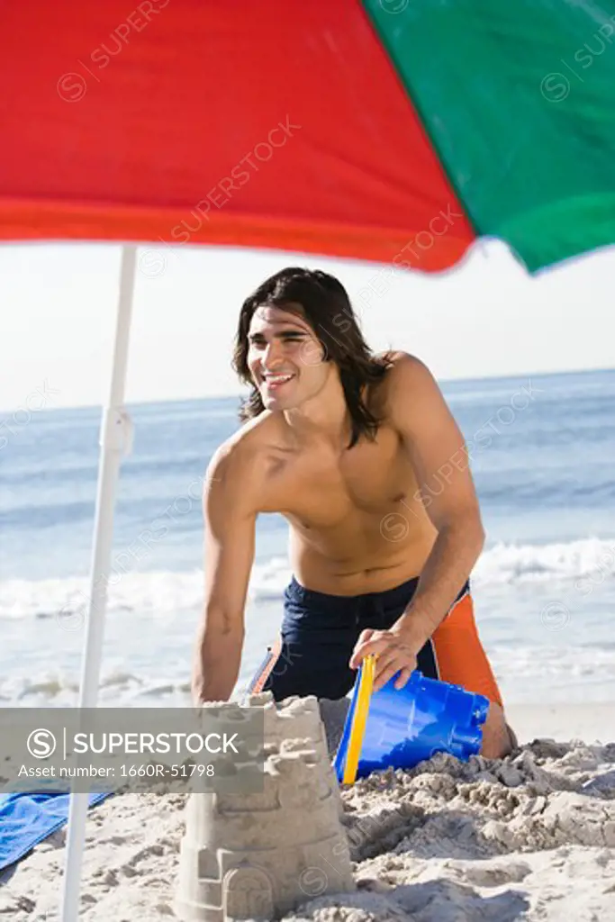 Man building a sand castle