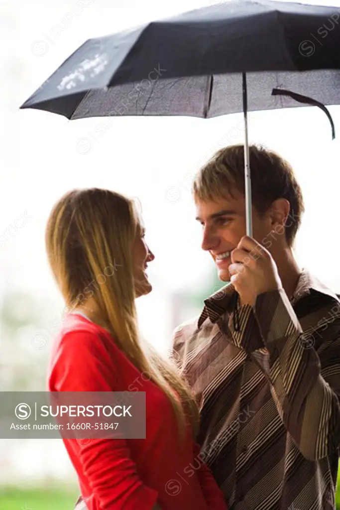 Couple with umbrella in the rain