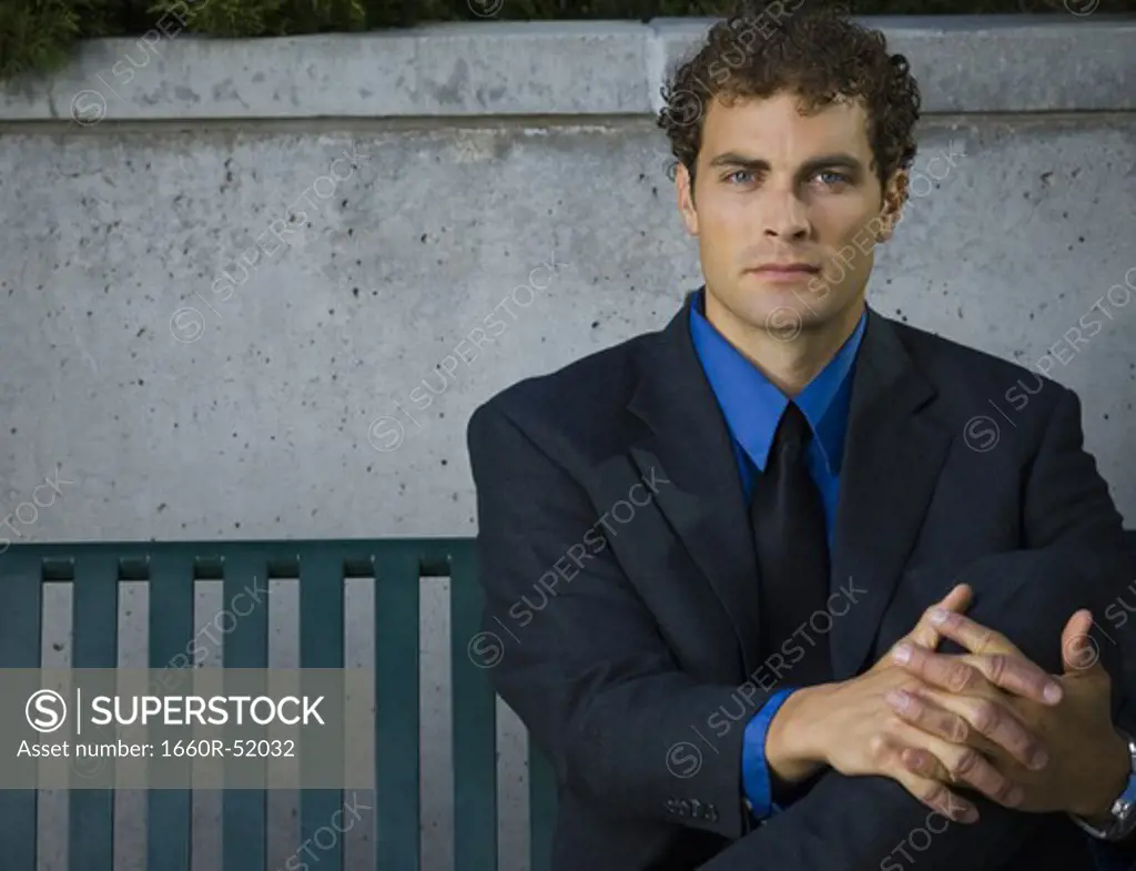 Businessman sitting on a bench