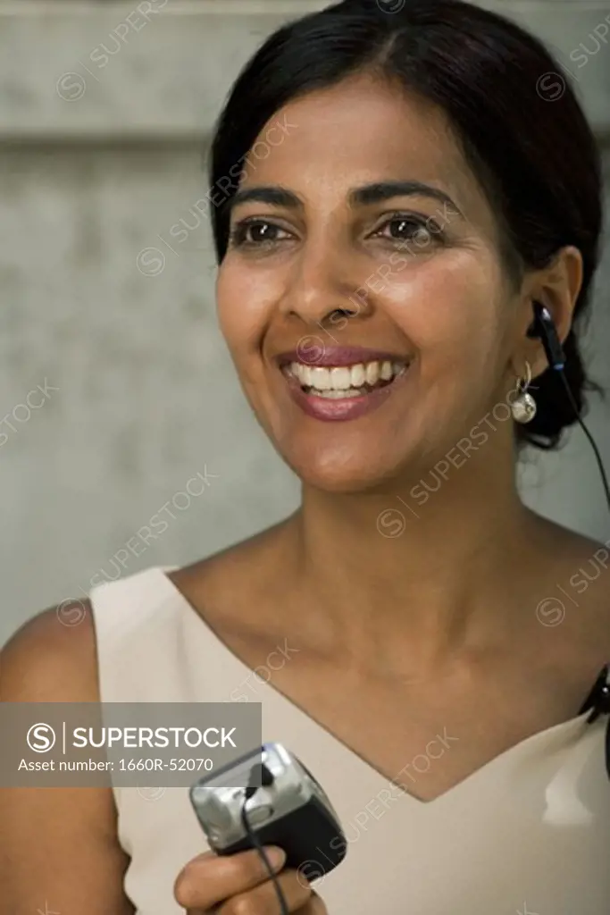 Woman with earbud
