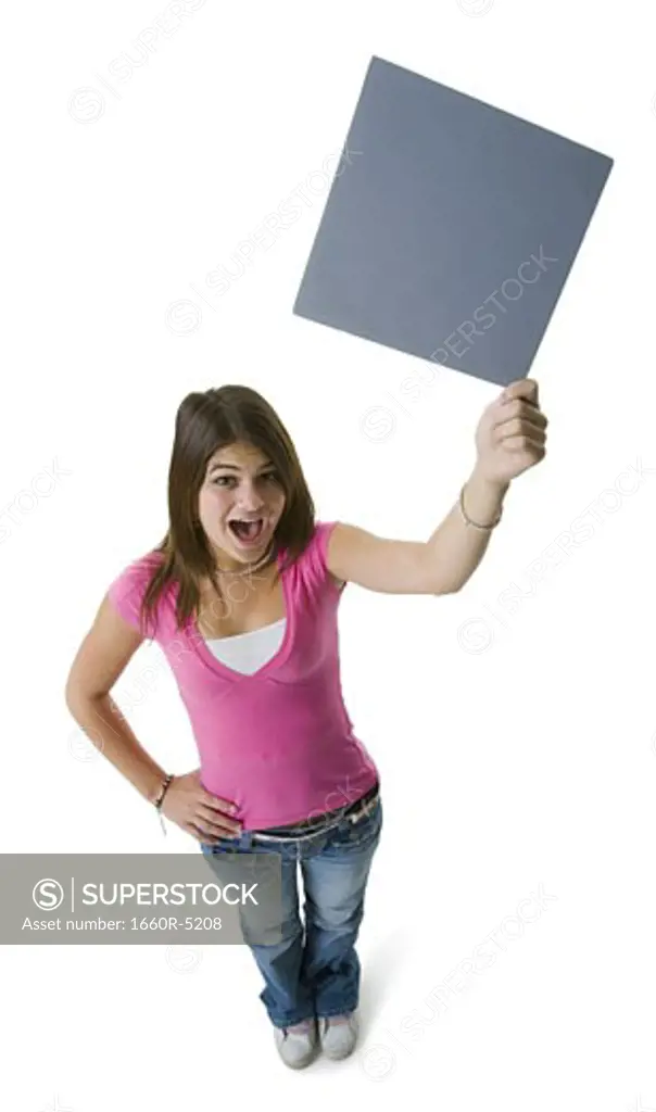 High angle view of a teenage girl holding a blank sign