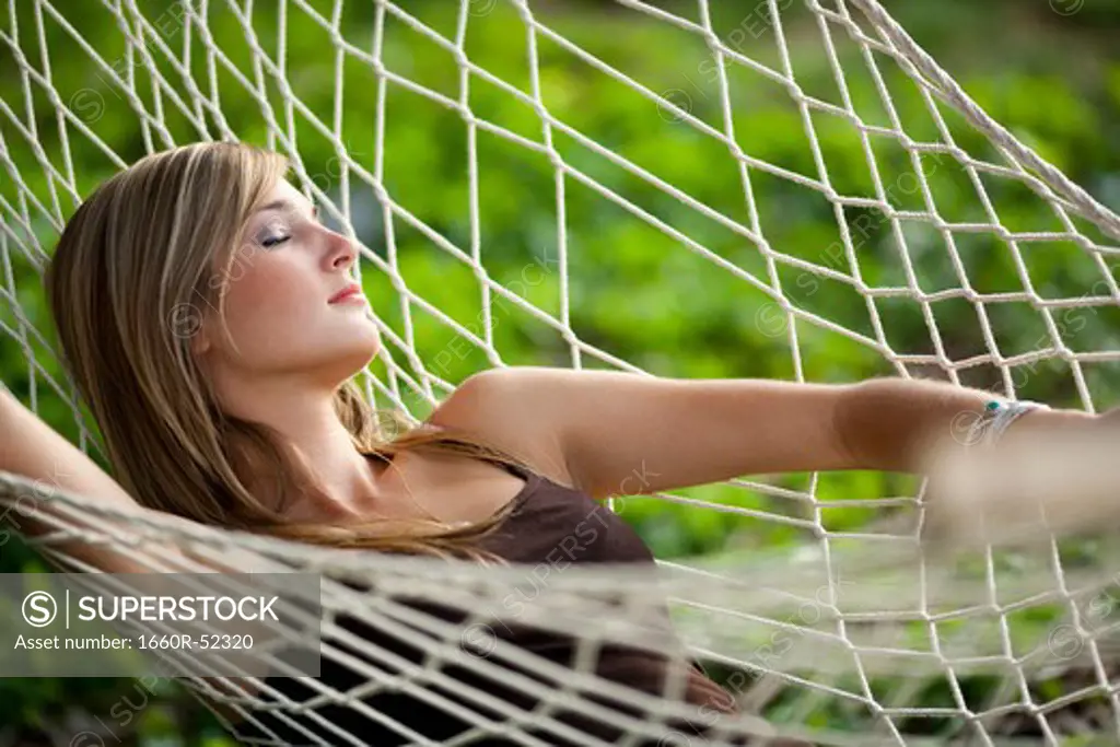 Teenage girl in a hammock sleeping