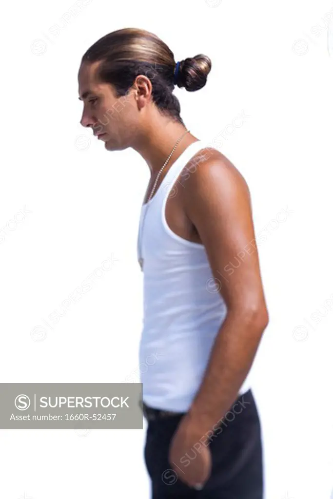 Man from waist up with ponytail