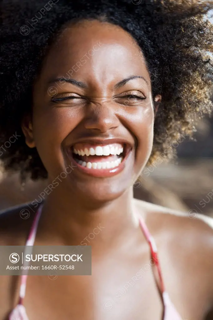 Woman smiling and squinting