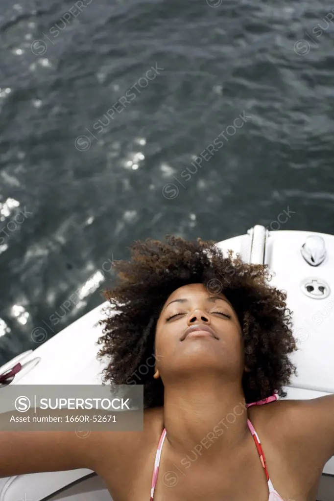 Woman in bikini on boat