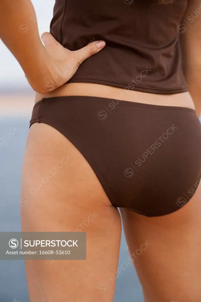 Woman in brown swimsuit