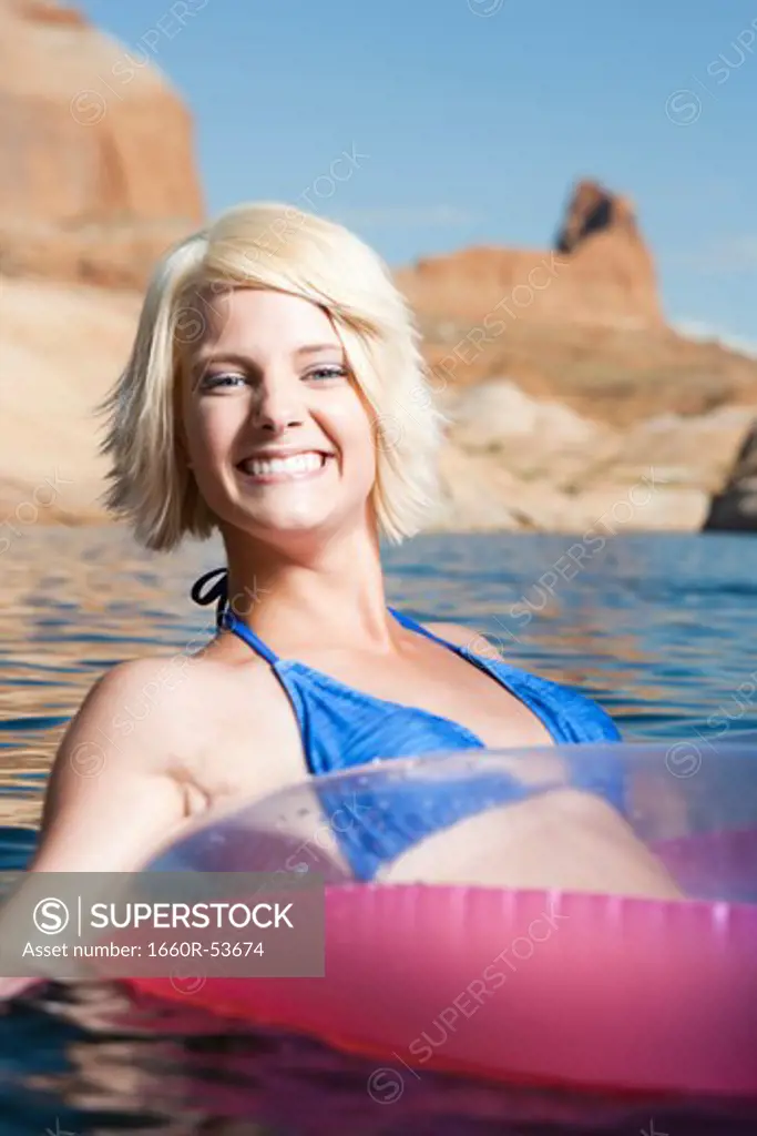 Woman floating on inflatable ring