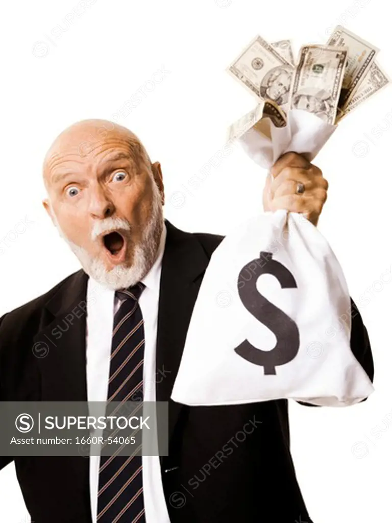 Portrait of businessman holding money bag