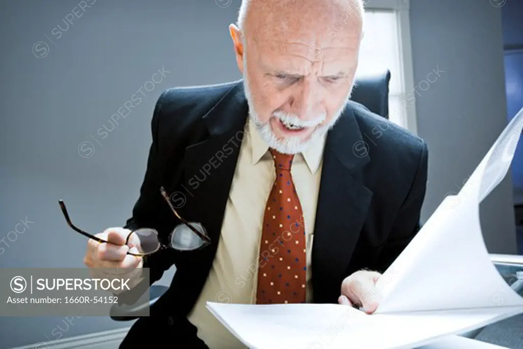 Closeup of businessman reading report