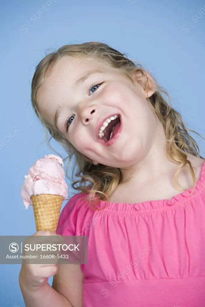 Portrait of a girl holding an ice-cream and smiling
