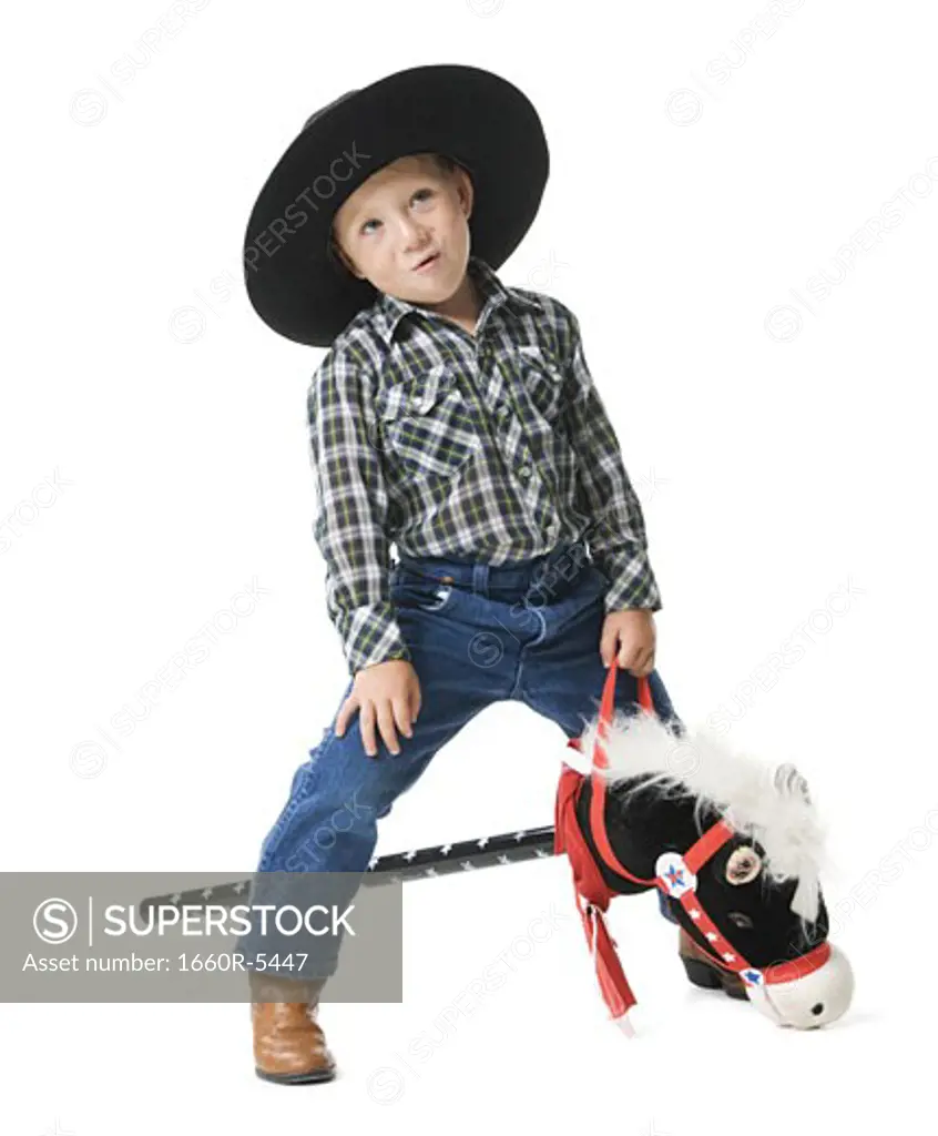 Boy riding a hobby horse