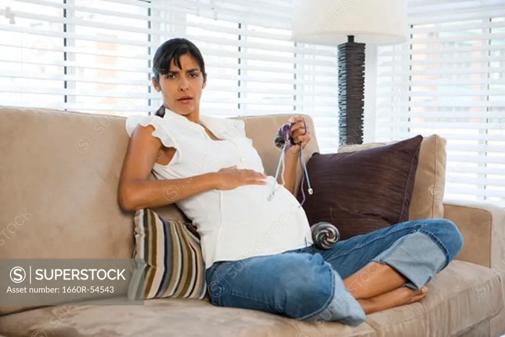 Pregnant woman knitting