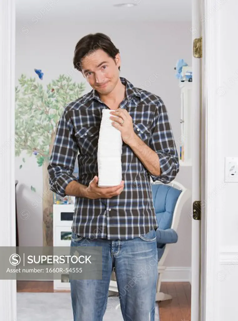 Man holding diapers