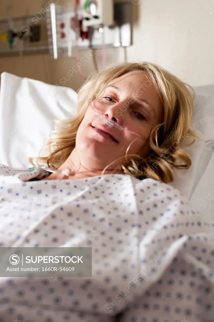 Woman sleeping in hospital bed