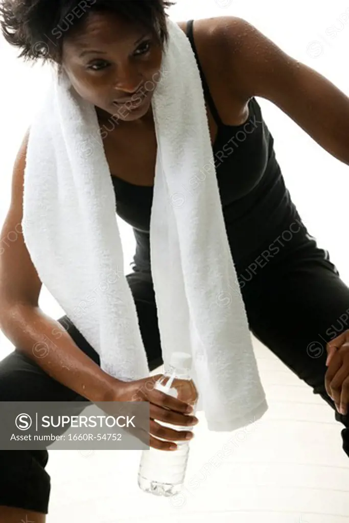 Woman with towel perspiring